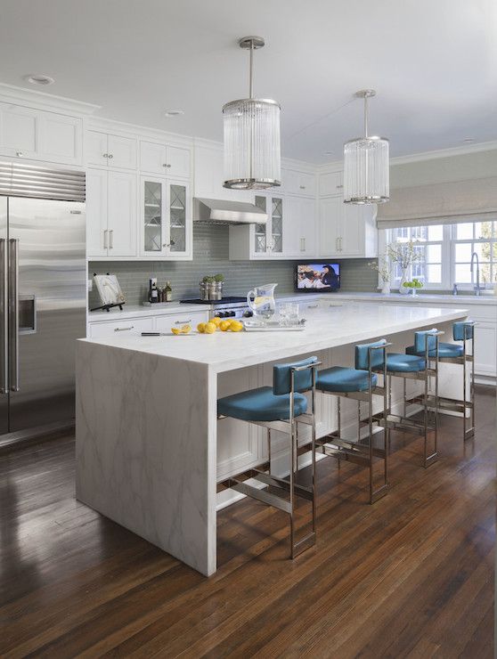 white marble-looking granite is durable and bring a modern vibe to these shaker cabinets