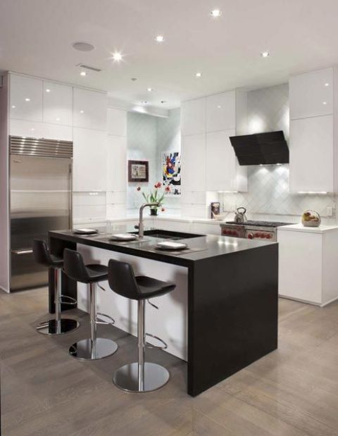 black wooden countertop bring a contrasting modern look to the kitchen