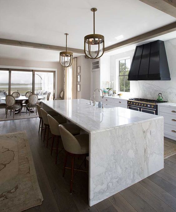 enjoy the durability of marble using it not only for a waterfall countertop but also for backsplashes
