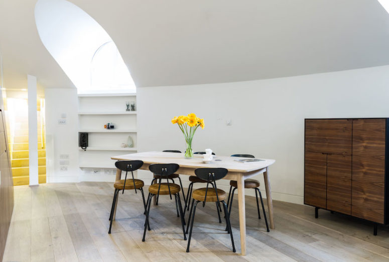 dining space The dining area is light colored, the floor is done in various shades of grey