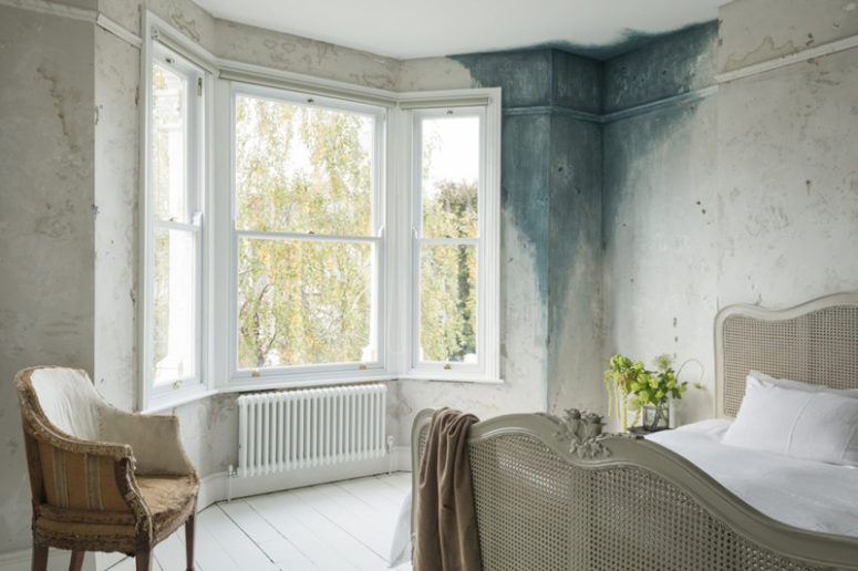 The bedroom is shabby and decadent, there's a touch of patina on one of the walls