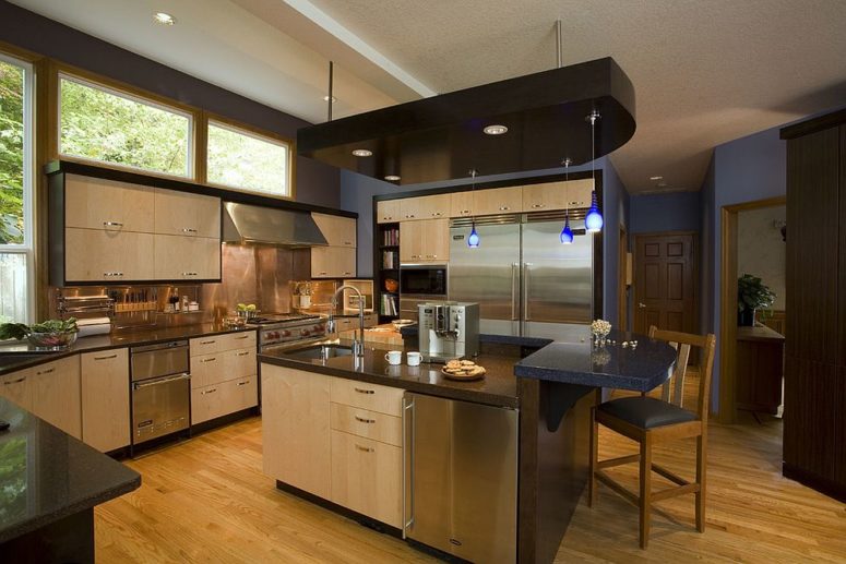 stainless steel kitchen with a polished copper backsplash