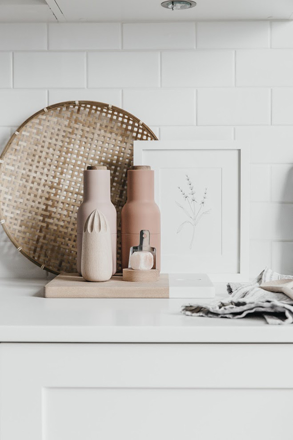 white kitchen The kitchen is white but pastels can be seen here, too, dinnerware and accessories are done in pink