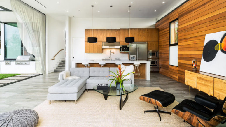 wood accent walls Warm woods on the walls make the space inviting and cozy, I also liek the comfy furniture