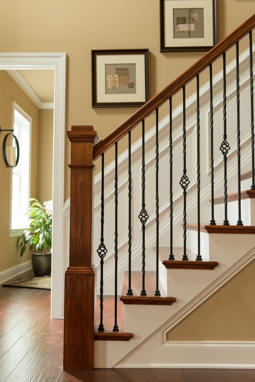 classic warm wood stairs with stylish iron railing can make a statement