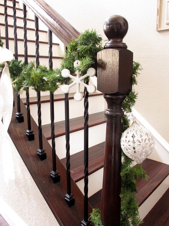 wrought iron spindles, dark stain and white trim