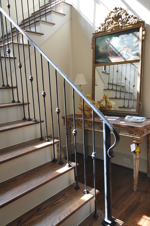 stylsish iron handrail and banister for a traditional staircase