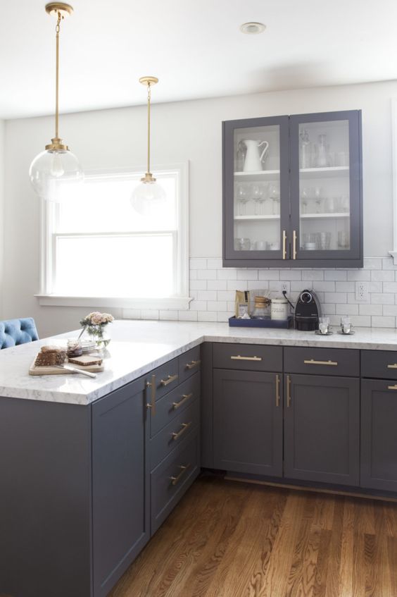  White Kitchen Cabinets With Dark Gray Quartz Countertops for Small Space