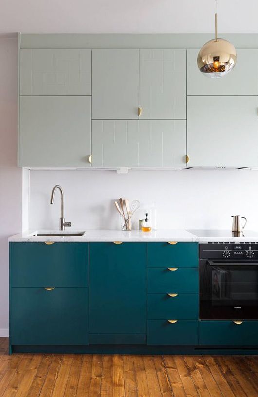 chic teal cabinets with gold handles make a cool statement