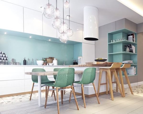 a white ktichen is spruced up with a mint backsplash and green chairs