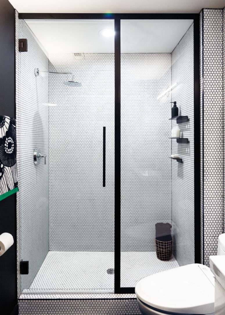 nice walk in shower The shower has customized doors and black shelves