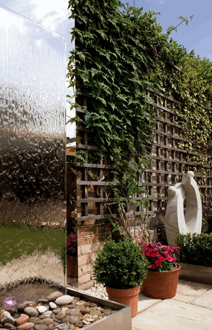 Transparent water wall combined with a tall trellis.