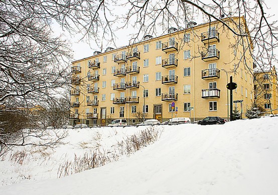 Apartment With Light Wood Floors & Painted White Walls