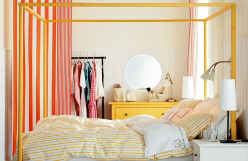 Bedroom With White Walls And Colorful Furniture