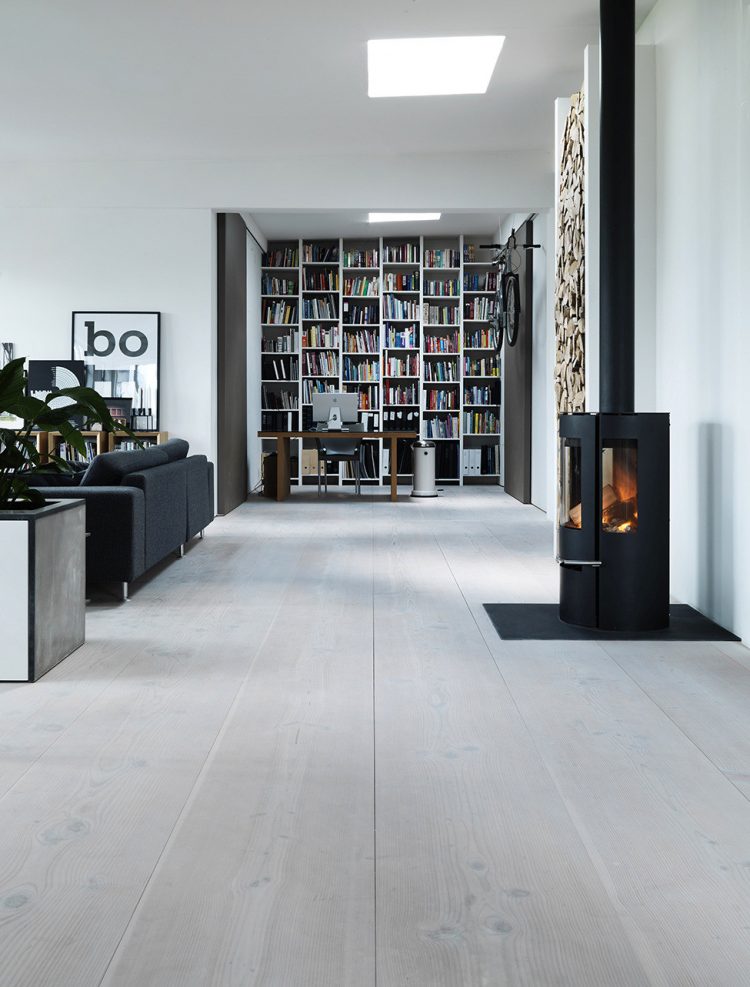 Functional Scandinavian Loft Of A Famous Architect this living room is combined with a small home office where all books are stored