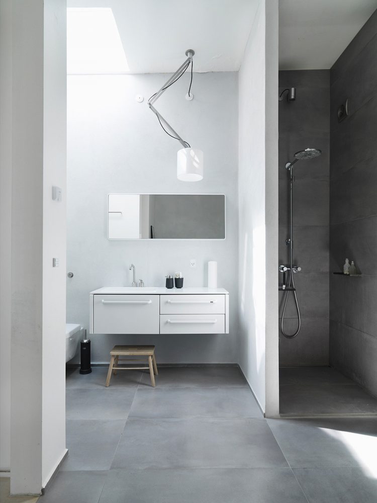 Functional Scandinavian Loft Of A Famous Architect the bathroom also features a very creative ceiling light solution