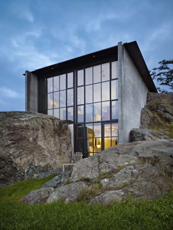 House With A Contrasting Interior Nestled Into The Rocks