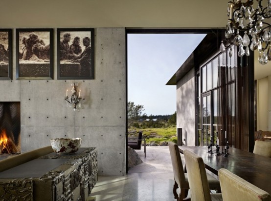 House With A Contrasting Interior Nestled Into The Rocks