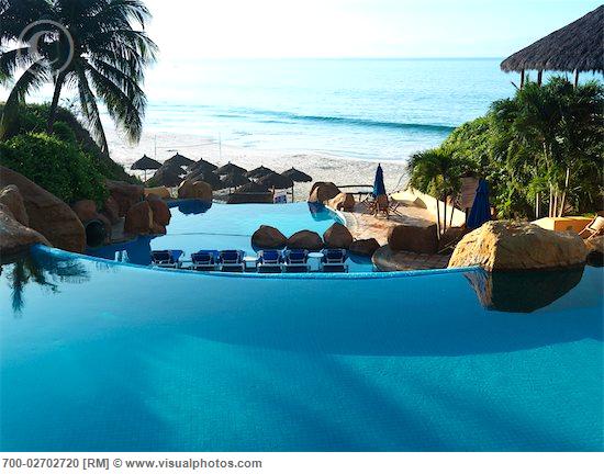 Infinity Pool At Rancho Banderas, Pacific Ocean In The Background, Puerto Vallarta, Mexico