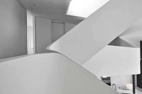 Minimalist White Loft Design With Sculptural Accents