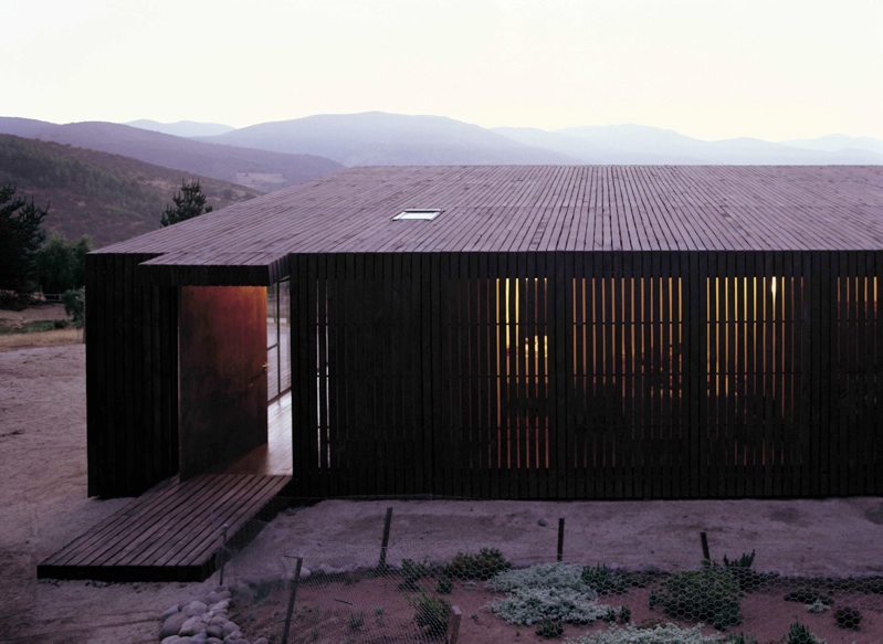 Modern Wooden House Designed Around a Deck | DigsDigs