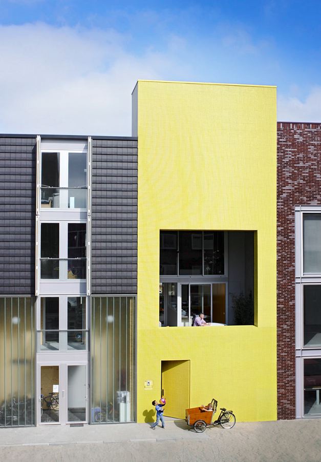 Patio House With The Bright Yellow Facade | DigsDigs