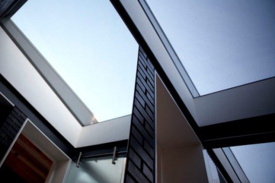 Shadow House Of Black Brick With Industrial Decor