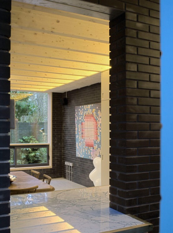 Shadow House Of Black Brick With Industrial Decor