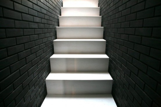 Shadow House Of Black Brick With Industrial Decor