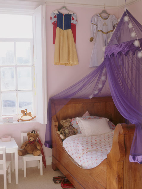 Small Girls Room With A Canopy Over The Bed
