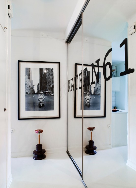 Tiny Black And White Studio With Wood Accents Tiny Black And White Studio With Wood Accents