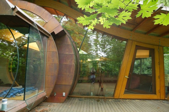 Curved Abstract House in Forest Made of Natural Materials