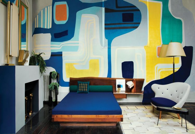 The master bedroom has a bold graphic wall that looks as an oversized art piece