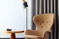 03 reading space with a mid-century modern chair and a wooden table