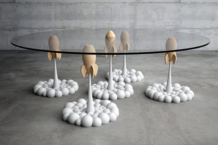 the Rocket table brings fluffy, cartoon like clouds and aerial rockets from a personal toy collection to life the Rocket table brings fluffy, cartoon-like clouds and aerial rockets from a personal toy collection to life