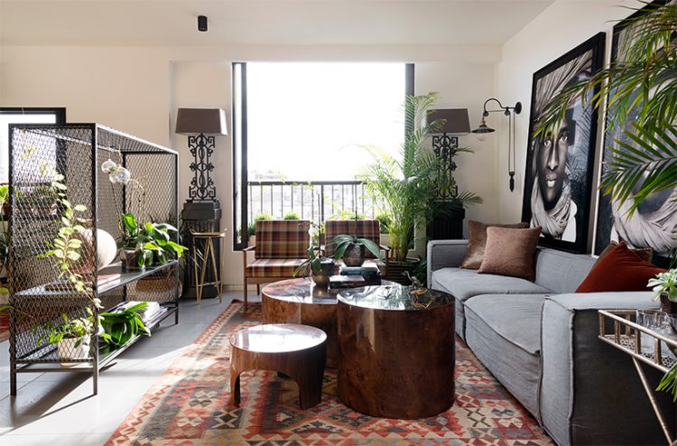the living room is decorated with slight boho touches