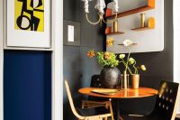 04 The dining zonemixes graphite black and orange or brass touches