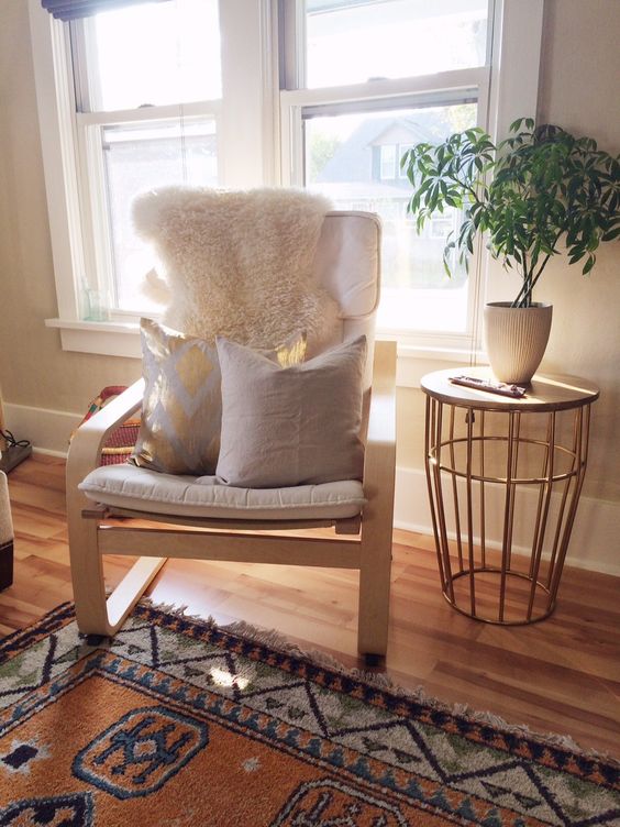 https://www.digsdigs.com/photos/04-off-white-Poang-chair-with-pillows-and-a-fur-cover-for-a-living-room.jpg