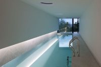 05 modern indoor narrow pool with lighting and a view