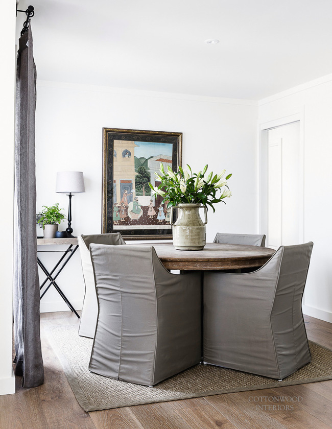 old farmhouse table is complimented with grey chairs