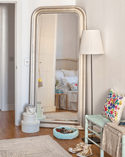 a mirror expands the space and works for the dressing corner