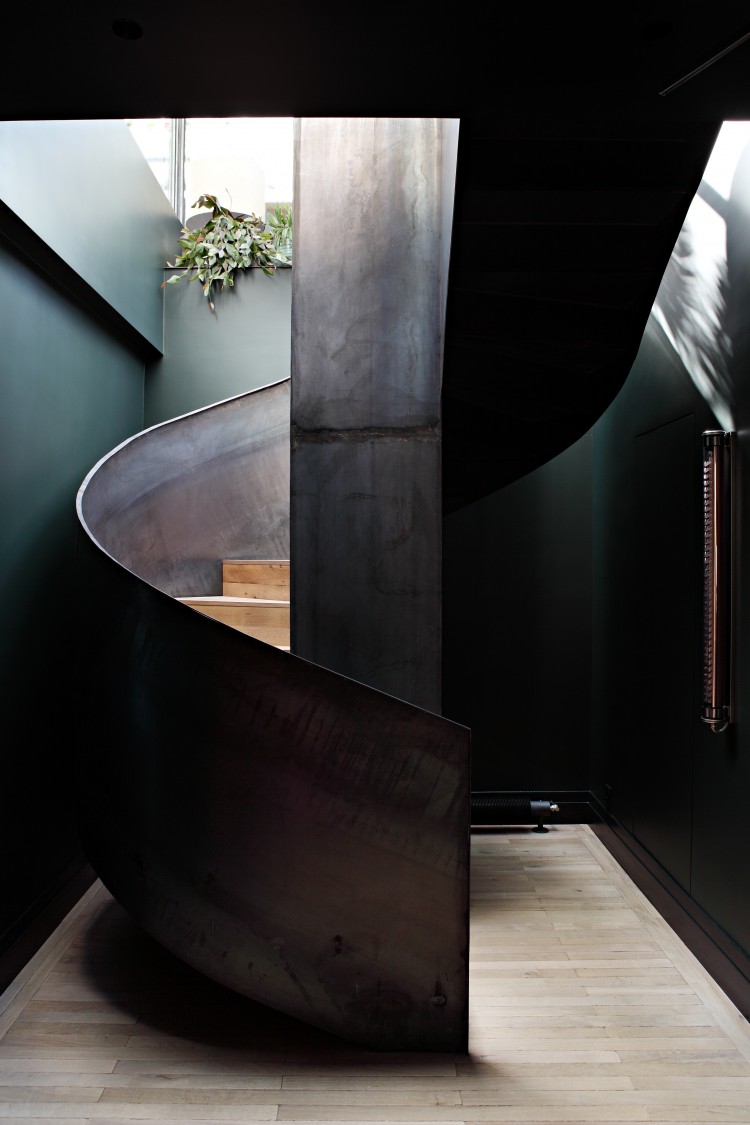 sculptural rough metal staircase makes a statement