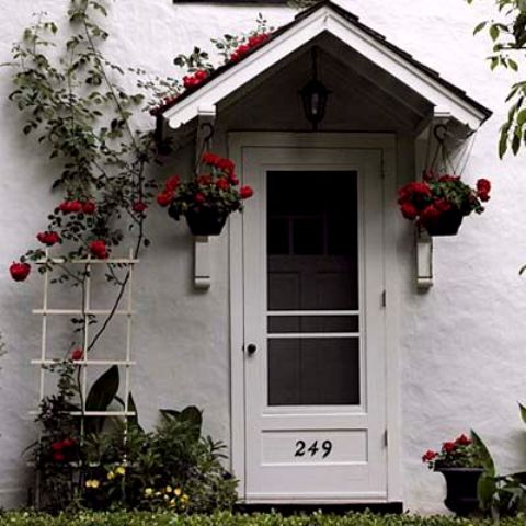 bedecked with roses front entries this old house