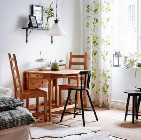 a lamp hanging right above the table