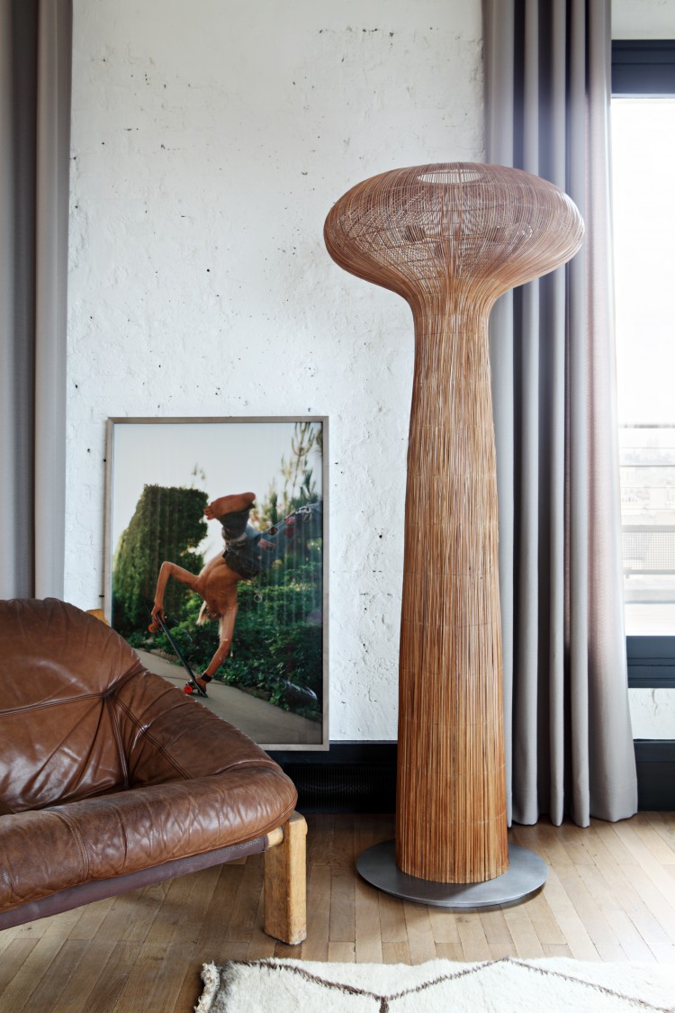 a unique floor lamp makes a statement in the living room