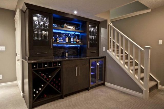 basement bar with built-in coolers and storage compartments