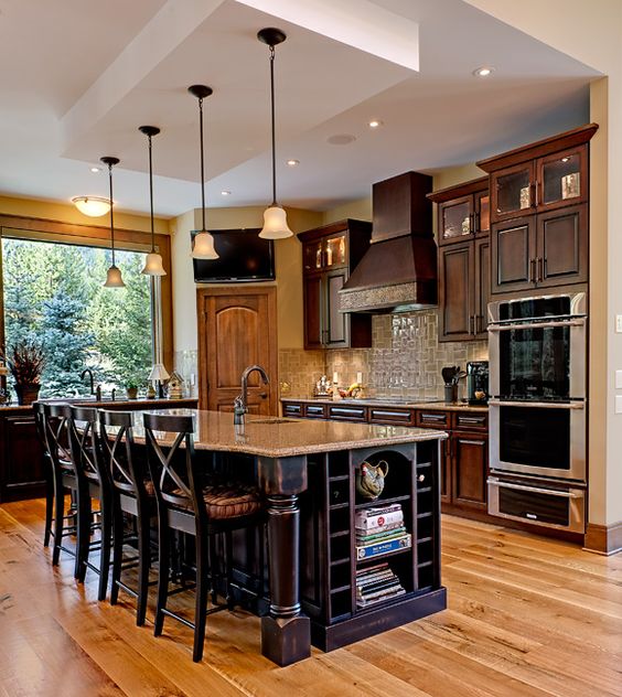 kitchen island with books and newspapers storage