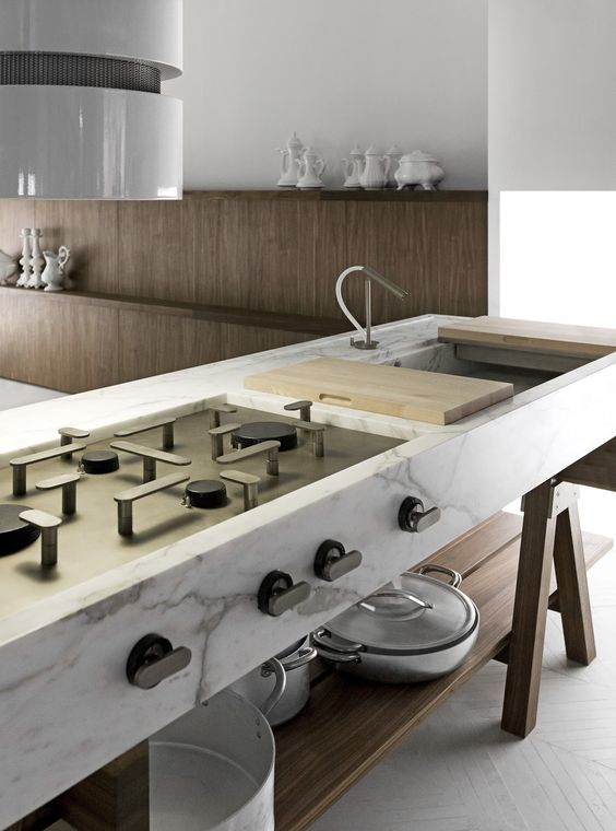 marble kitchen island with a cook top