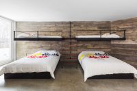 12 Reclaimed wood and earthy-colored concrete floor make this bedroom cozier
