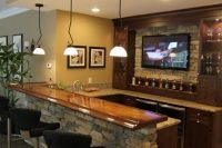 14 basement bar with a stone countertop